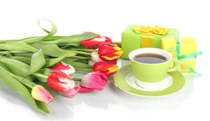 Beautiful tulips in bucket with gifts and cup of tea isolated