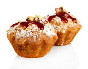 Tasty muffin cakes with strawberries jam, isolated on white