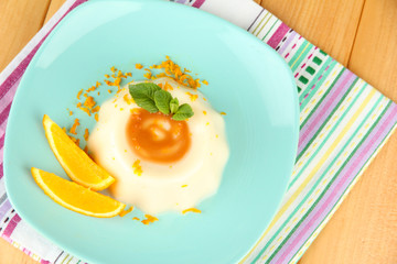 Panna Cotta with orange zest and caramel sauce,