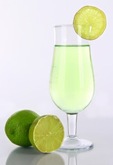 Green cocktail with lime isolated on white