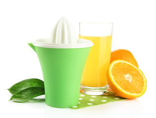 Citrus press, glass of juice and ripe oranges, isolated on