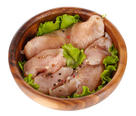 Chicken meat in wooden bowl isolated on white