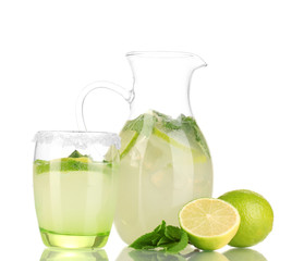 Lemonade in pitcher and glass isolated on white