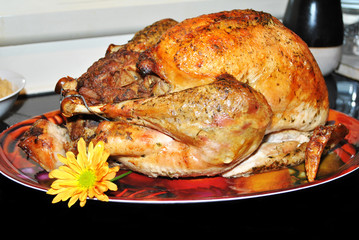 Cooked Turkey on a Platter with a Fall Daisy