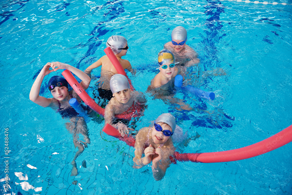 Wall mural happy children group  at swimming pool