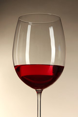 Glass of wine on gray background