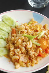 Stir penne pasta with pork and tomato sauce