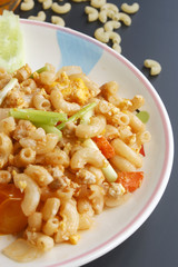 Stir penne pasta with pork and tomato sauce