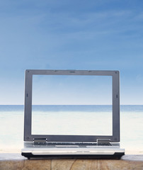 Open laptop showing beach landscape
