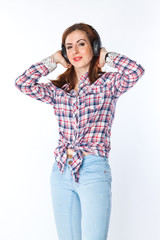 Fototapeta premium young and beautiful woman listening to music on headphones