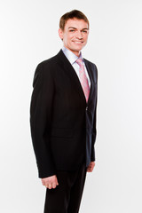 Fototapeta premium A young and successful business man in a dark business suit