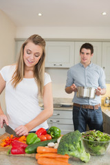 Young couple preparing dinner