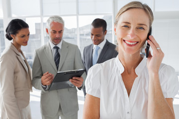 Smiling woman on a phone conversation