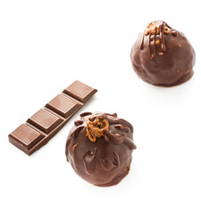 Two delicious dark chocolate candies isolated on a white backgro