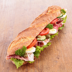 sandwich with ham,lettuce,cucumber and tomato