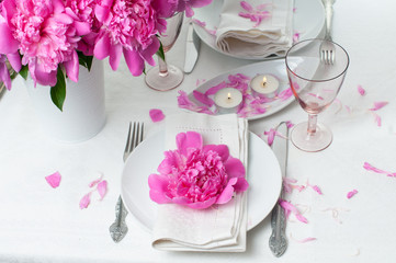 festive table setting with pink peonies