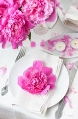 festive table setting with pink peonies