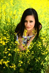 Naklejka na ściany i meble Beautiful Young Woman Outdoors. Enjoy Nature