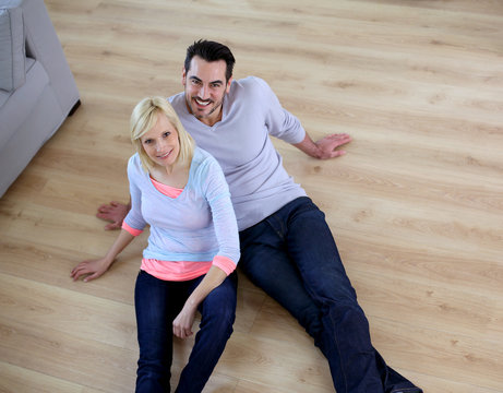 Upper view of couple relaxing on the floor