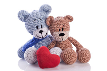 two teddy bears with red  heart pillow love