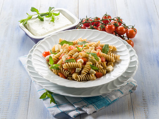 pasta with feta cheese fresh tomatoes and mint leaf