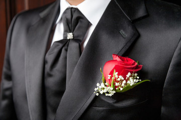 Groom in elegant black wedding dress