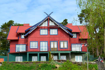 Fototapeta na wymiar The red wooden house in Nida, Lithuania