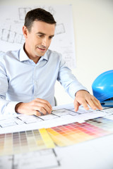 Architect sitting at drawing table