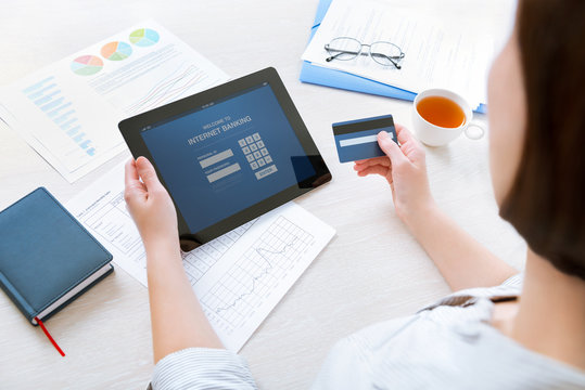 Businesswoman Using A Credit Card For Online Internet Banking