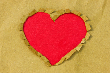 Naklejka na ściany i meble Paper hole in a heart shape