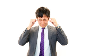 頭痛を訴えるビジネスマン