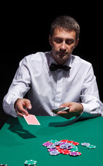Gentleman in white shirt, playing cards