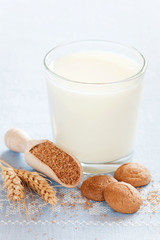 Bran cookies and glass of milk, selective focus