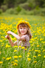Naklejka na ściany i meble Cute little girl wearing floral wreath outdoors