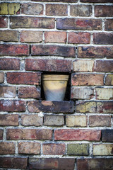 Old brick wall pattern closeup with flowerpot