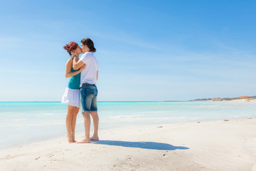 Young Couple Embraced in a Caribbean Beach