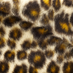 close up shot of fake leopard tiger fur texture background