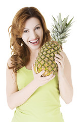 Happy woman with fresh pineapple fruit