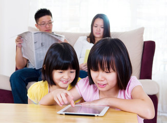 Asian children using tablet computers