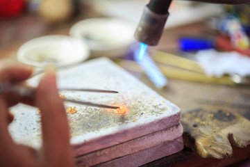Goldsmith making gold