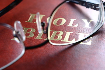 Holy Bible and Eye Glasses
