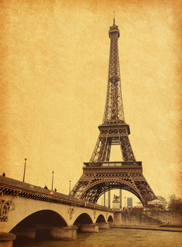 Eiffel tower view from Seine river.  Photo in retro style.