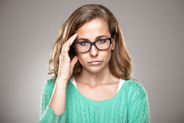Portrait of stressed woman having head pain.