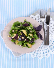 Light salad on plate on napkin