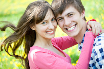Closeup portrait of smiling young couple