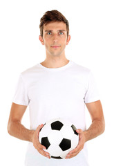 Young soccer player holding ball, isolated on white