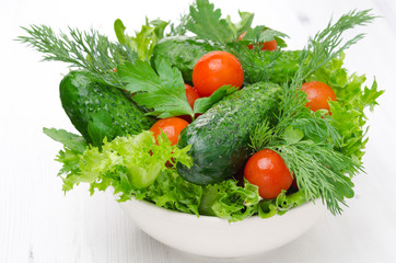 bowl with fresh vegetables and herbs for salad horizontal