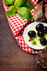 Olives and Olive Oil on an old tablel