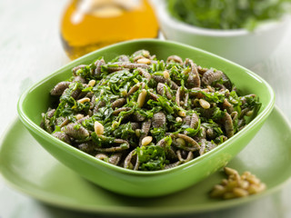 integral pasta with arugula pesto, selective focus