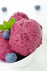 refreshing blueberry sorbet in white bowl close-up
